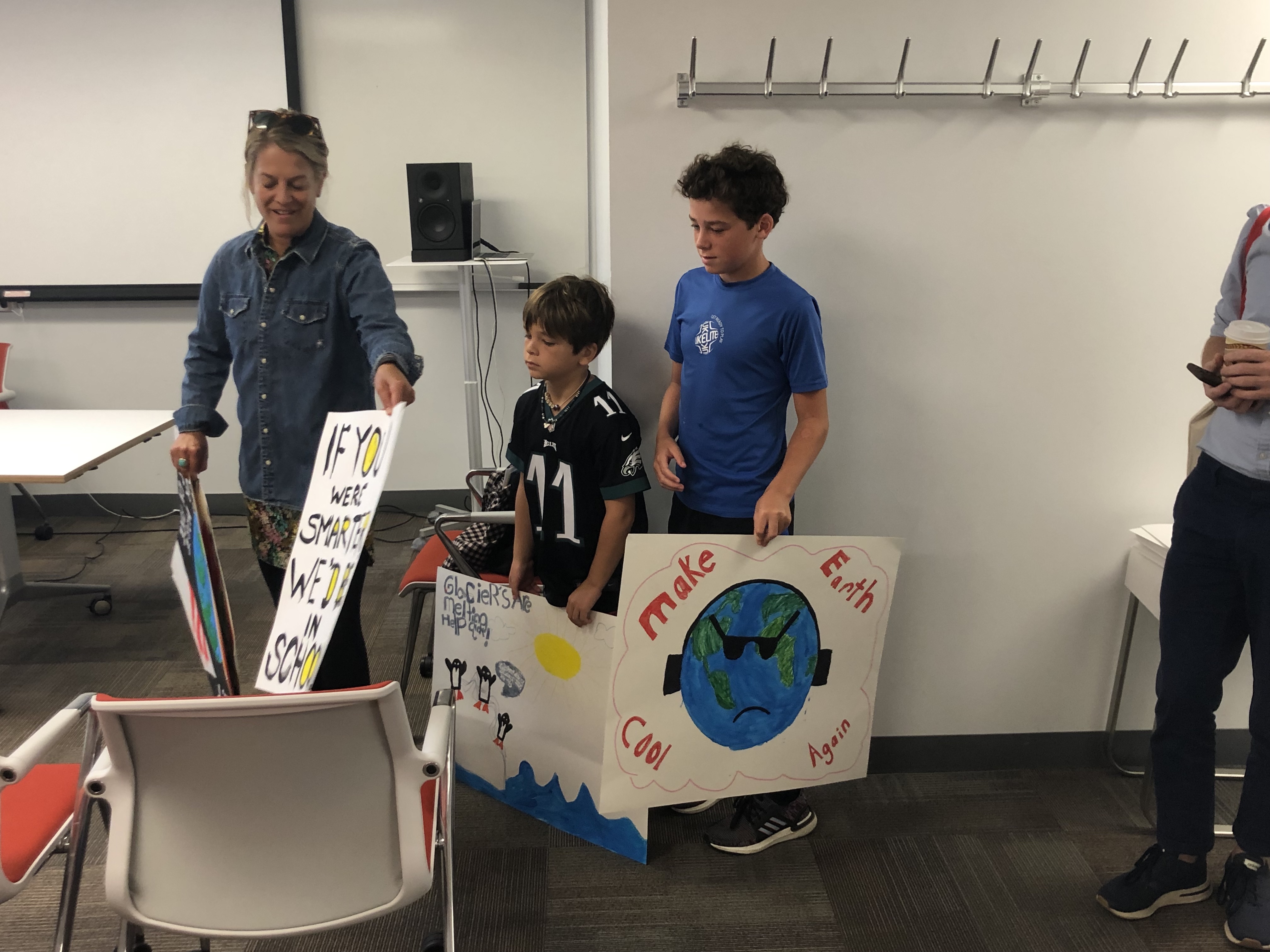 PPEH Faculty Director Bethany Wiggin and her kids brief attendees about the climate strike on September 20th. 