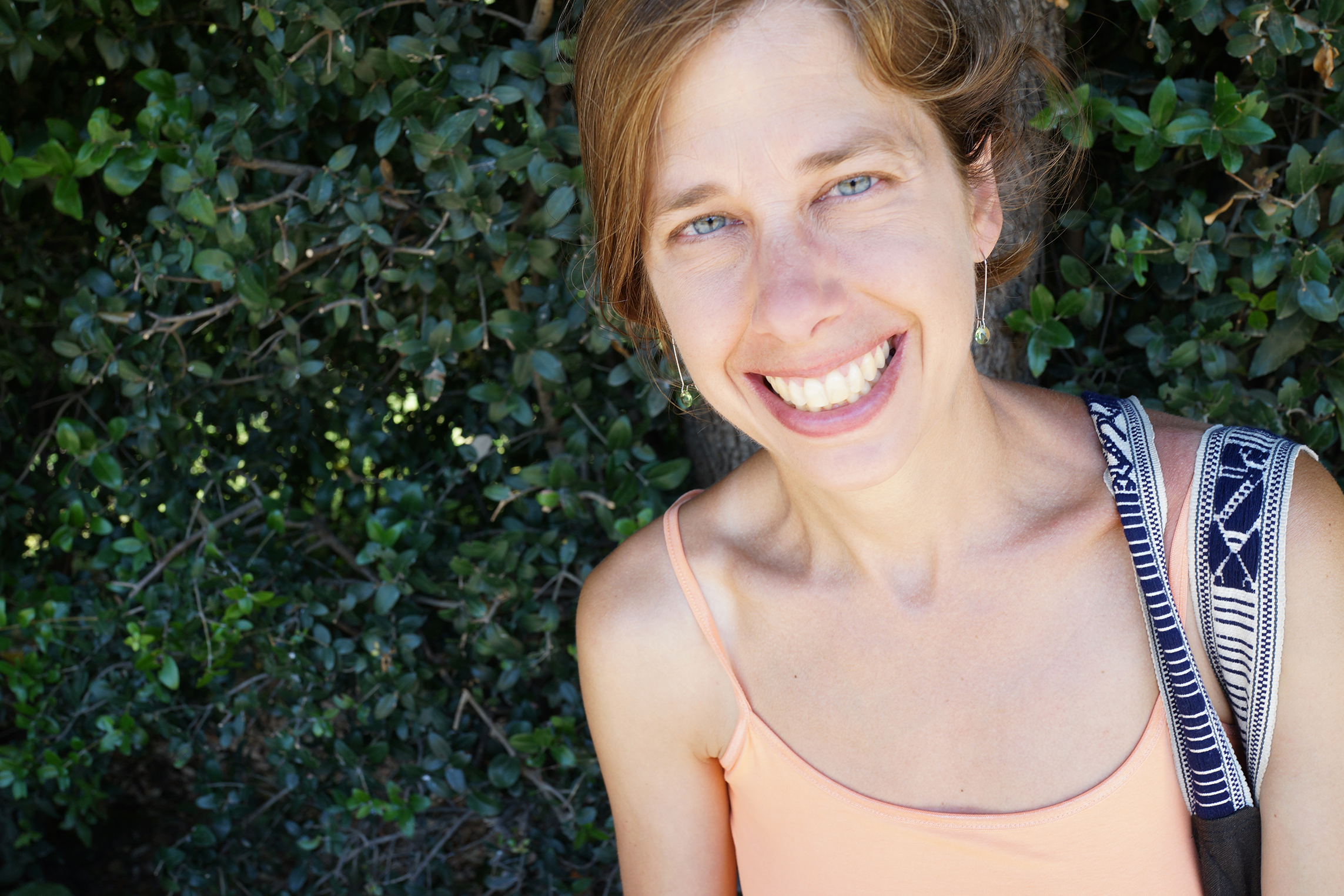 Miranda Mote smiling in front of greenery