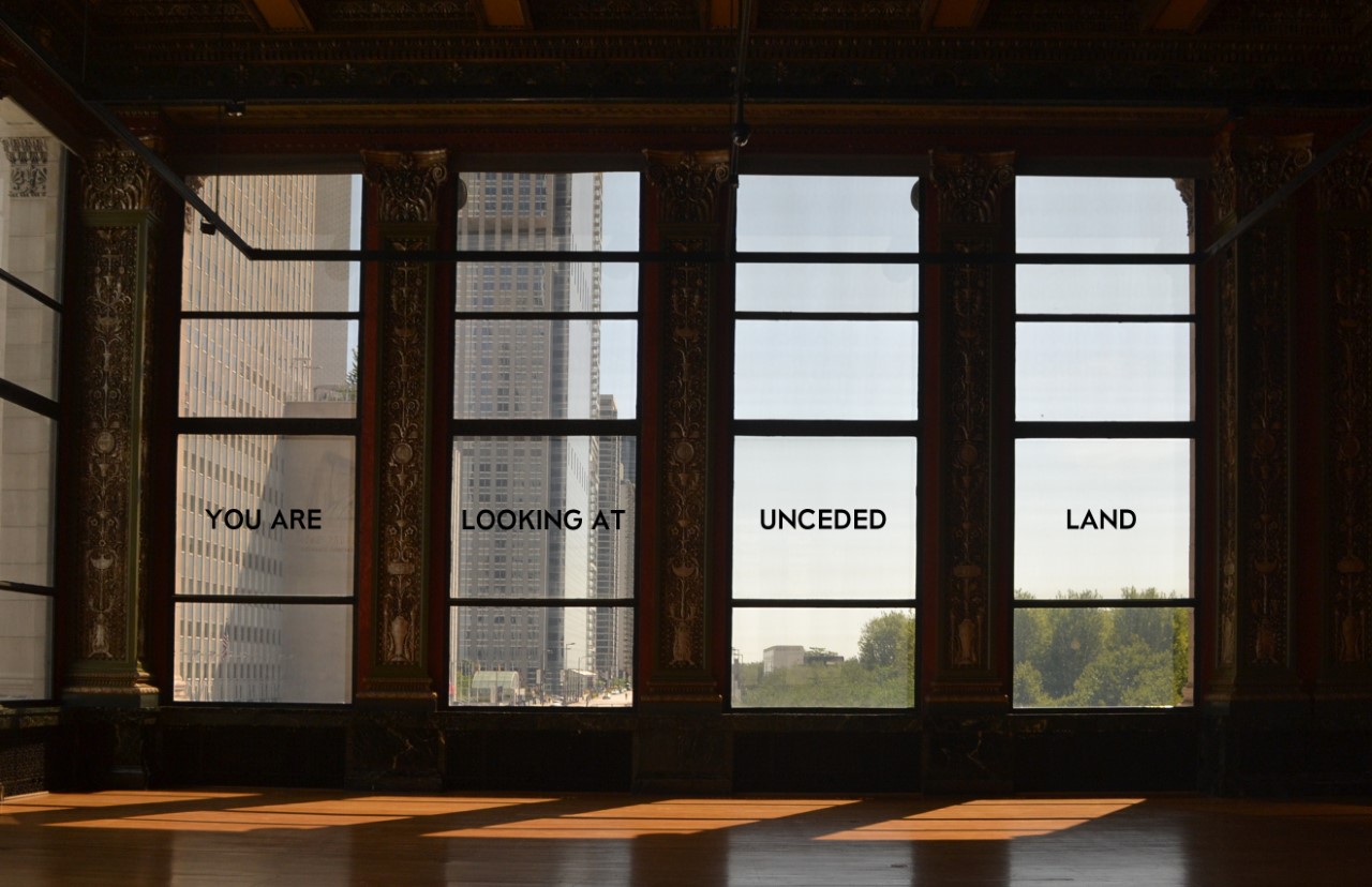 You are looking at unceded land appears in text on a series of four windows.