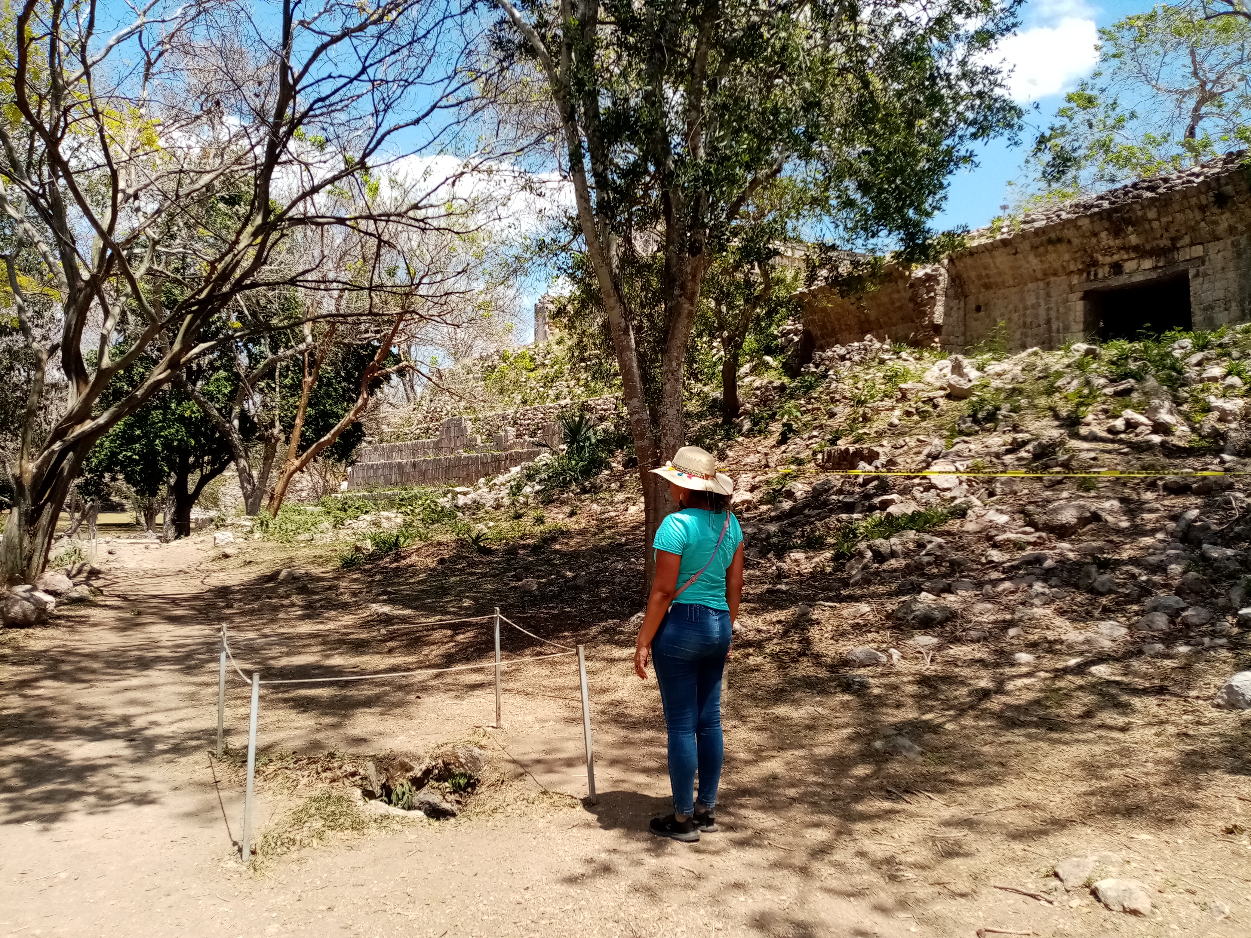 Woman standing in dry, wooded area in rural Mexico