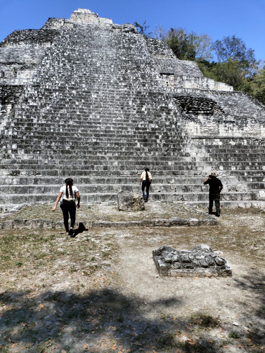 People ascending Mayan pyramid