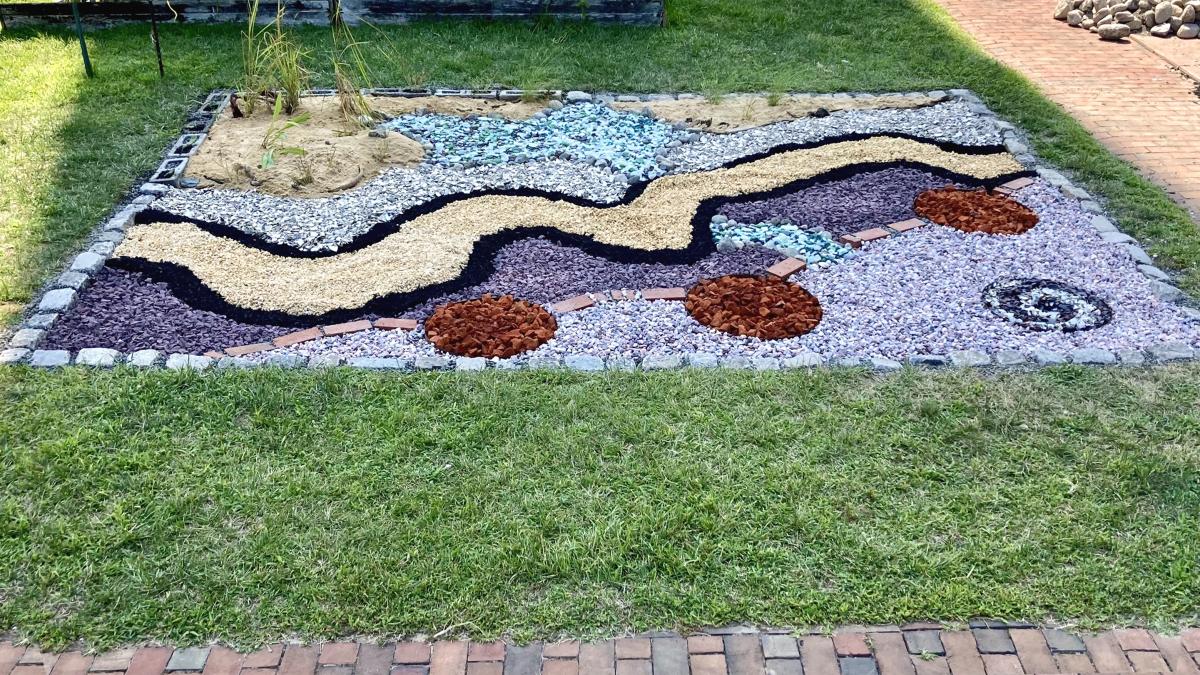 Nancy Agati, Water Table, an installation of gravel, stone, brick, shell, sand, sea glass, and mulch 