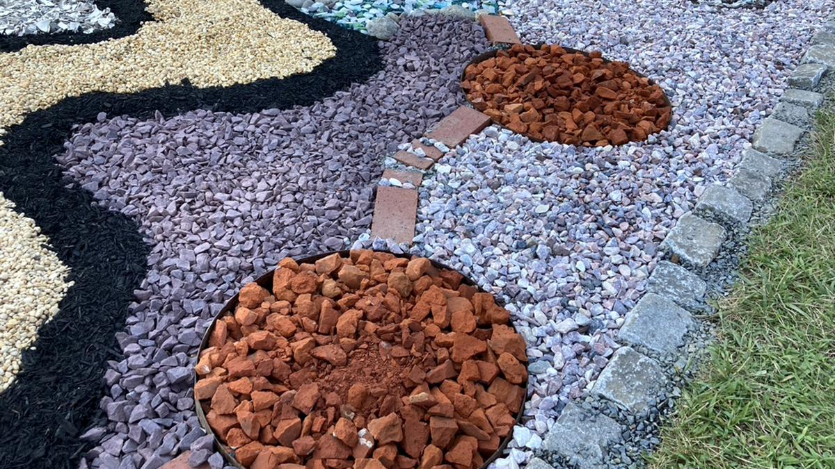 Nancy Agati, Water Table, an installation of gravel, stone, brick, shell, sand, sea glass, and mulch 